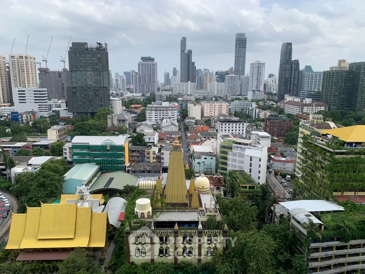 Stunning cityscape view showcasing modern skyscrapers and lush greenery in a vibrant urban setting.