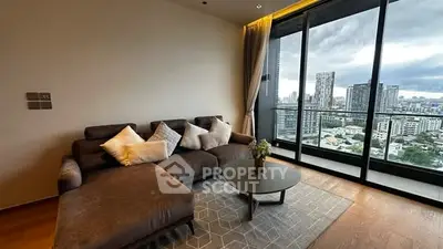 Modern living room with stunning city view and cozy sofa setup