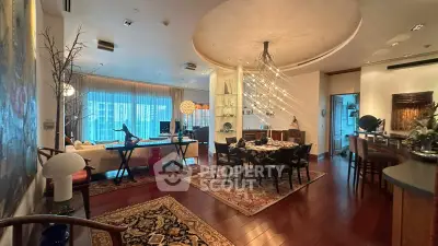 Luxurious open-plan living and dining area with elegant decor and ambient lighting.