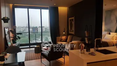 Modern living room with city view, stylish furniture, and open layout in a high-rise apartment.