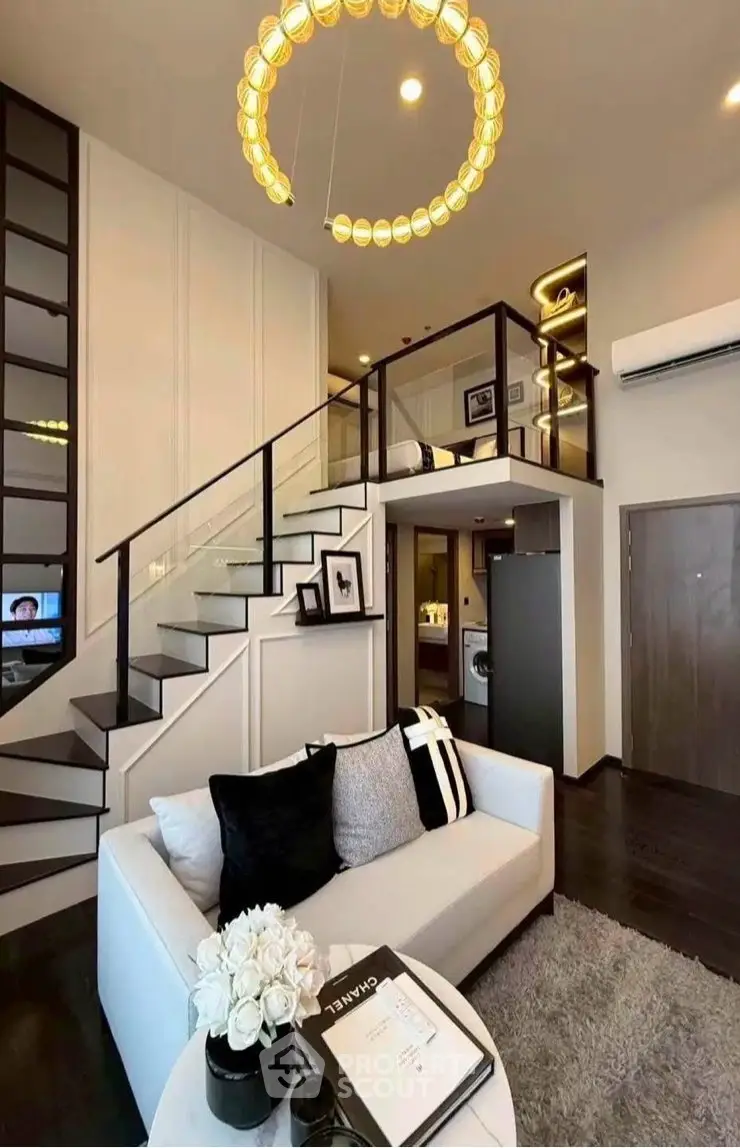 Modern loft apartment with stylish living room and elegant staircase