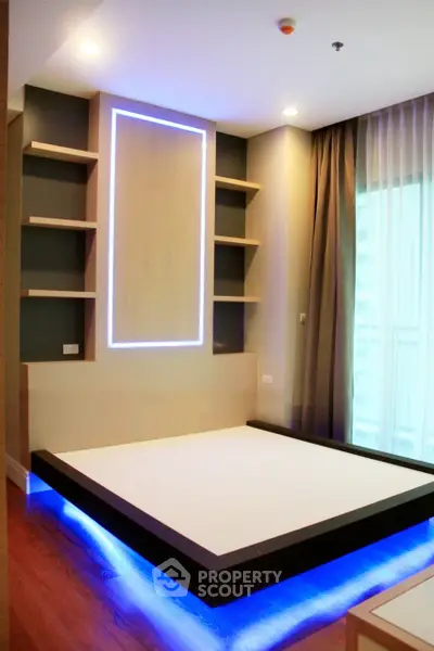 Modern bedroom with unique platform bed and ambient lighting