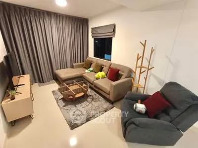 Cozy living room with modern furniture and stylish decor, perfect for relaxation and entertainment.
