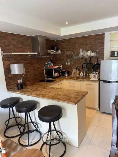 Modern kitchen with open layout and stylish bar stools