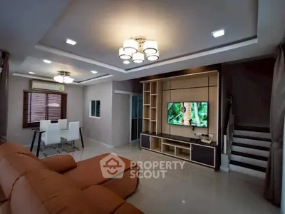Modern living room with stylish furniture and built-in entertainment center