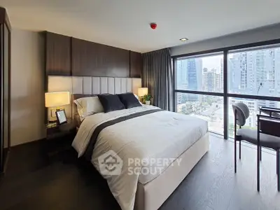 Luxurious bedroom with city view and modern decor in high-rise apartment