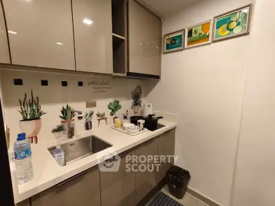 Modern compact kitchen with sleek cabinets and stylish decor