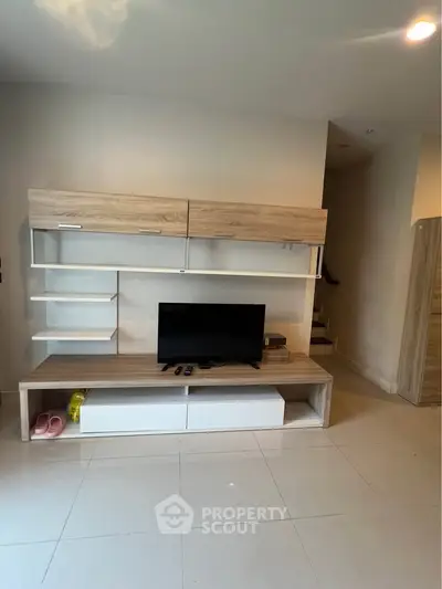 Modern living room with sleek TV unit and minimalist design