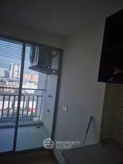 Modern apartment with balcony offering city views and ample natural light.