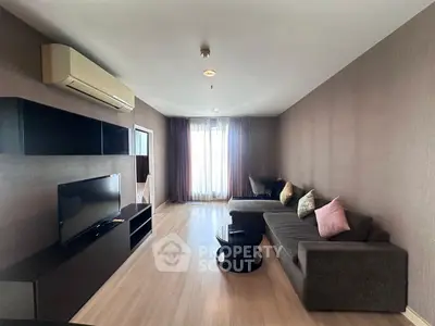 Spacious modern living room with sleek furniture and natural light