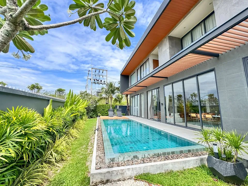 Luxurious modern villa with private pool and lush garden, perfect for relaxation and entertainment.