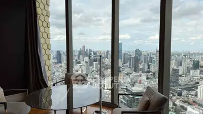 Stunning cityscape view from a high-rise apartment with floor-to-ceiling windows and elegant interior.