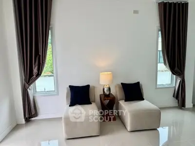 Elegant living room with plush seating and modern decor