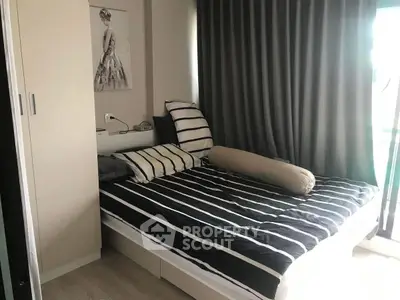 Cozy bedroom with striped bedding and modern decor