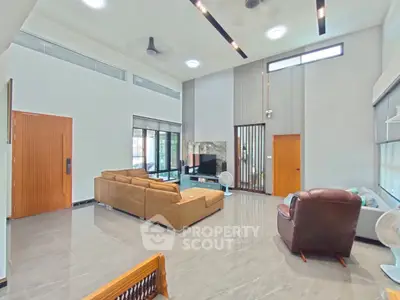 Spacious modern living room with high ceilings and stylish furniture