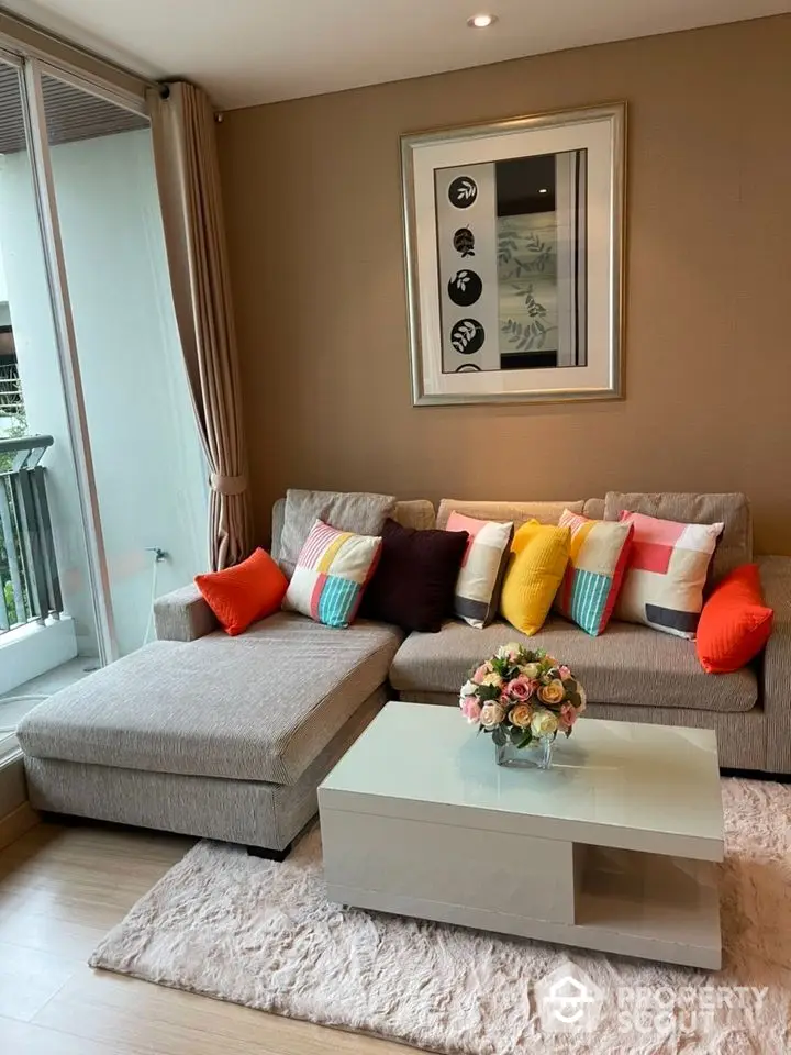 Stylish living room with modern sofa and vibrant cushions, perfect for relaxation and entertaining.