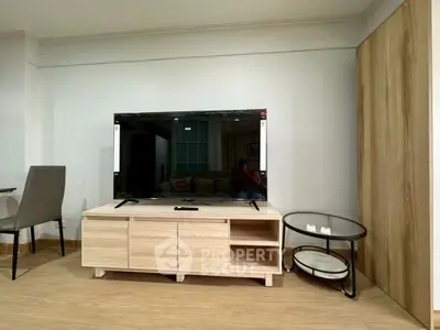 Modern living room with sleek TV stand and stylish furniture