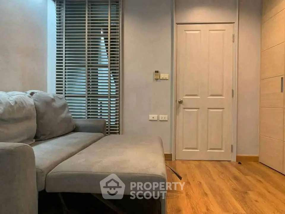 Cozy living room with modern sofa and wooden flooring