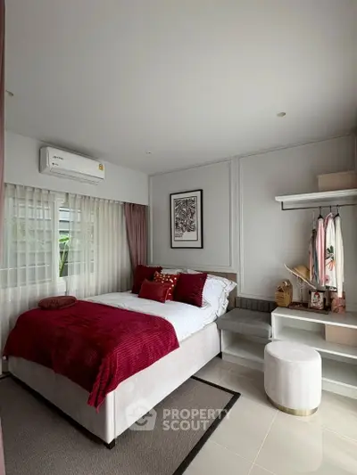 Chic modern bedroom with plush decor and natural light
