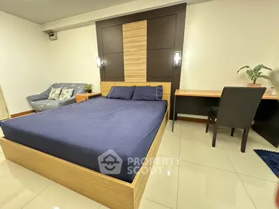 Spacious modern bedroom with sleek furniture and cozy ambiance