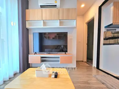 Modern living room with sleek TV setup and stylish wooden furniture