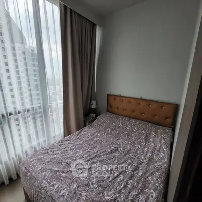 Cozy bedroom with city view and elegant curtains