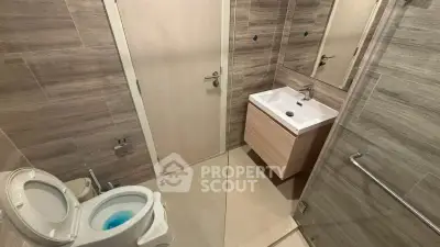 Modern bathroom with sleek fixtures and neutral tones
