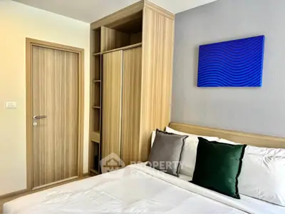 Modern bedroom with stylish decor and cozy bedding