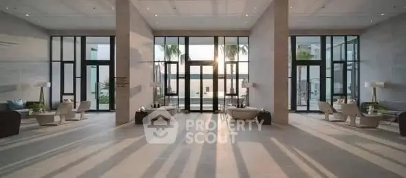 Luxurious modern lobby with elegant seating and floor-to-ceiling windows