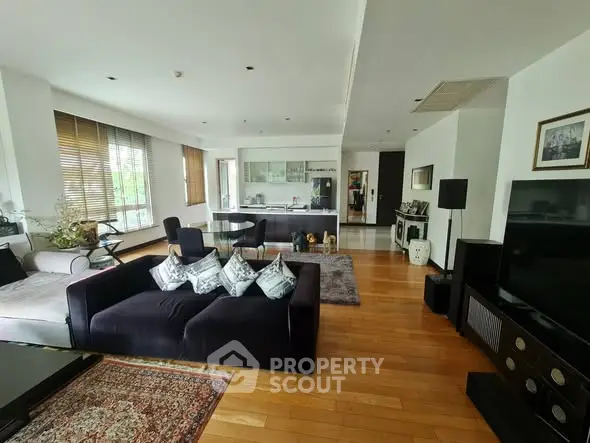 Spacious modern living room with open kitchen and stylish decor