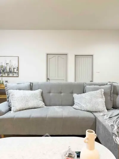 Modern living room with stylish gray sofa and elegant decor