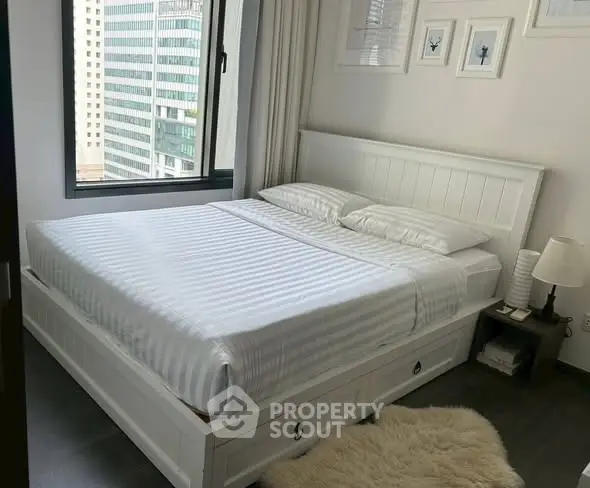 Cozy modern bedroom with city view and elegant decor