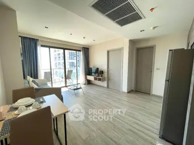 Spacious modern living room with balcony in a high-rise apartment