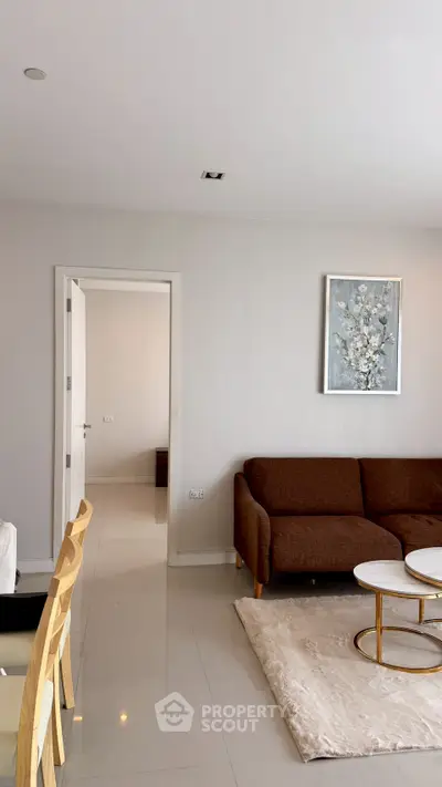 Modern living room with elegant brown sofa and stylish decor