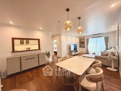 Spacious modern living room with elegant dining area and cozy seating.