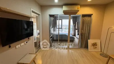 Modern apartment interior with bedroom view and wall-mounted TV