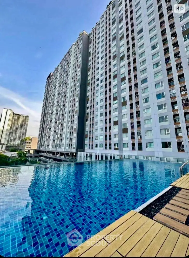 Stunning high-rise building with luxurious infinity pool and city views.