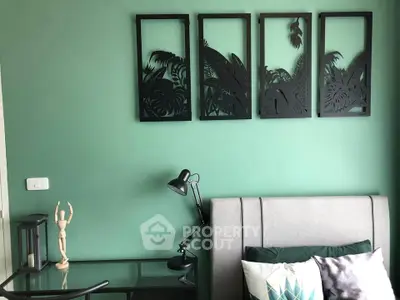 Stylish bedroom with modern decor and artistic wall frames, perfect for a cozy and elegant living space.