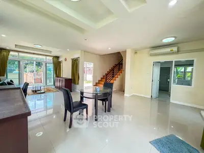 Spacious modern living room with open layout and elegant dining area