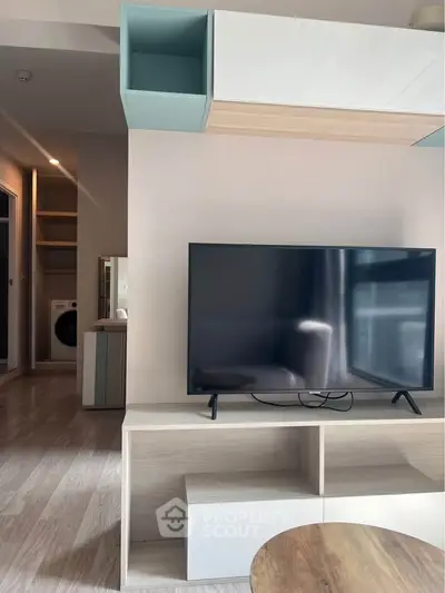 Modern living room with sleek TV unit and stylish decor