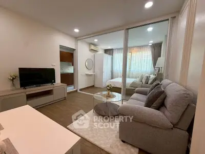 Modern open-plan living room with cozy sofa and stylish decor