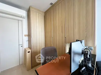 Modern study room with wooden cabinets and sleek desk setup
