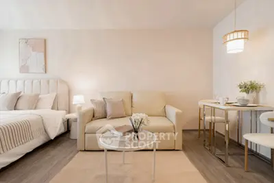 Elegant studio apartment with cozy living area and stylish decor