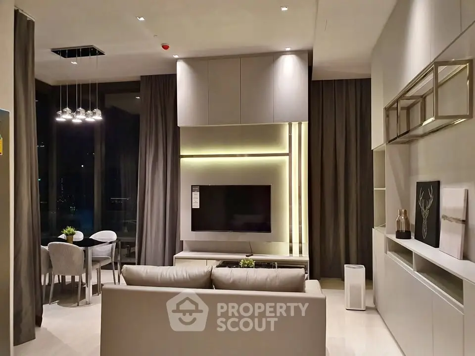 Modern living room with elegant decor and ambient lighting in a luxury apartment.