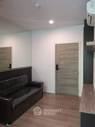 Modern living room with sleek design and wooden flooring