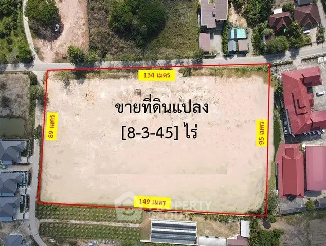 Aerial view of a large plot of land for sale with dimensions marked.