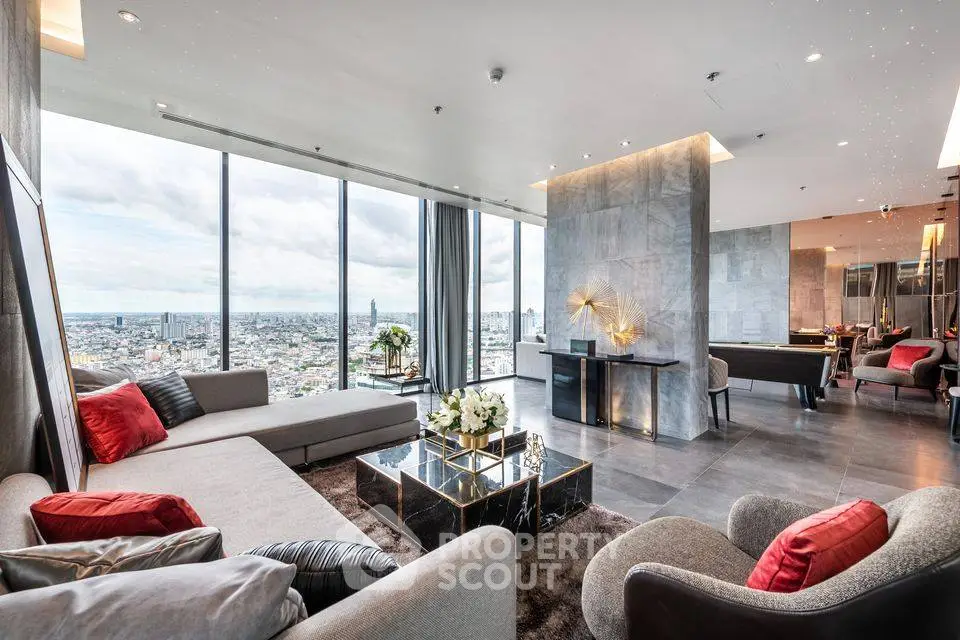 Luxurious modern living room with panoramic city views and elegant decor.