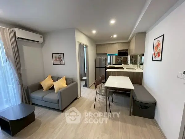 Modern living room with open kitchen and stylish decor