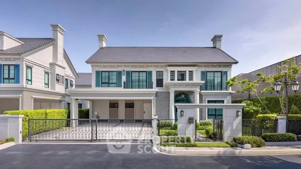 Luxurious modern house with elegant facade and spacious driveway in a serene neighborhood.