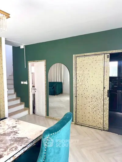 Stylish modern interior with green walls and elegant furniture